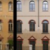 Scuola G. Poerio, Milano, facciata del 1920 restaurata con la tecnica del graffito
